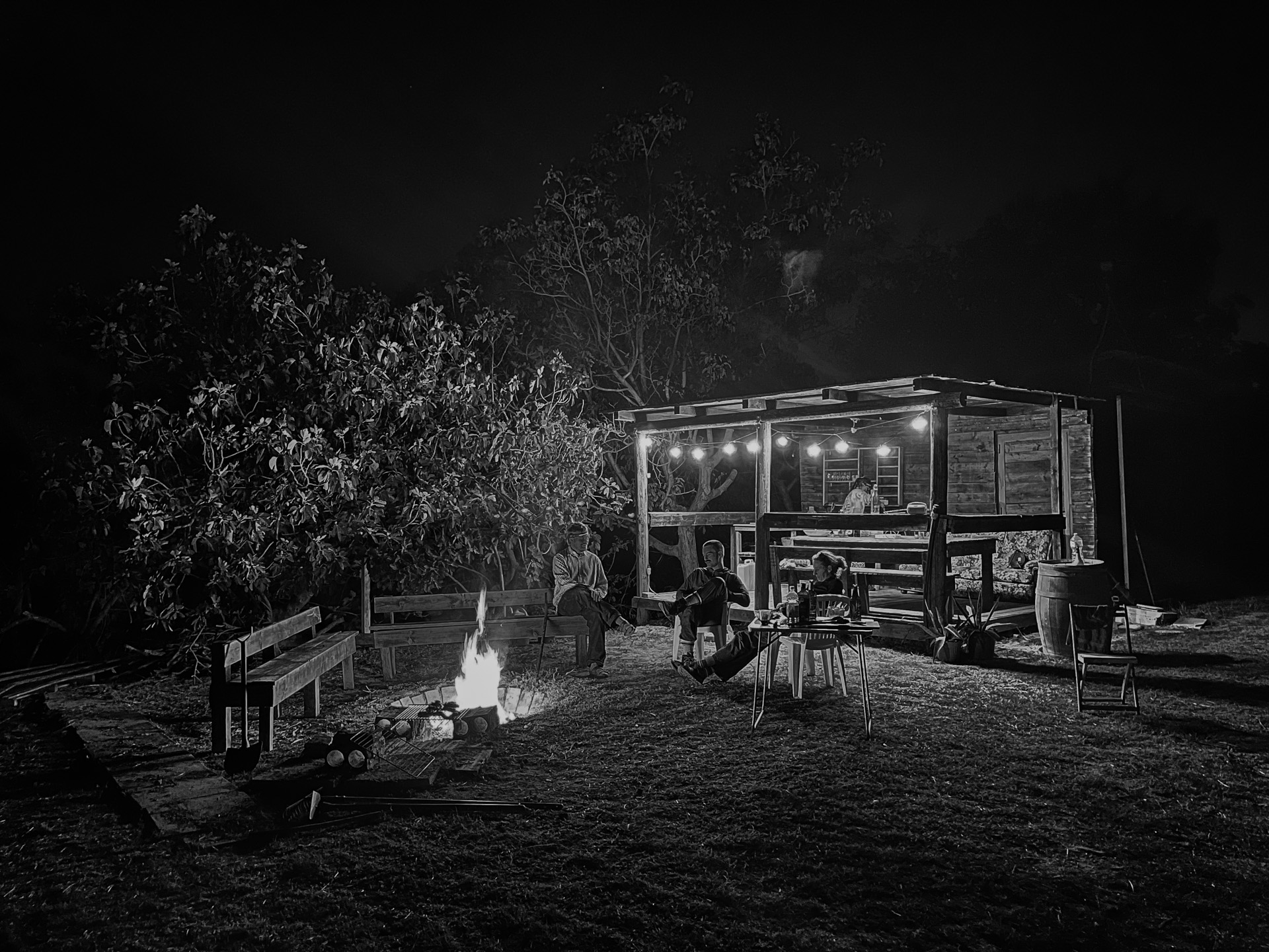 Nighttime scene at Sentieri with fire and shelter